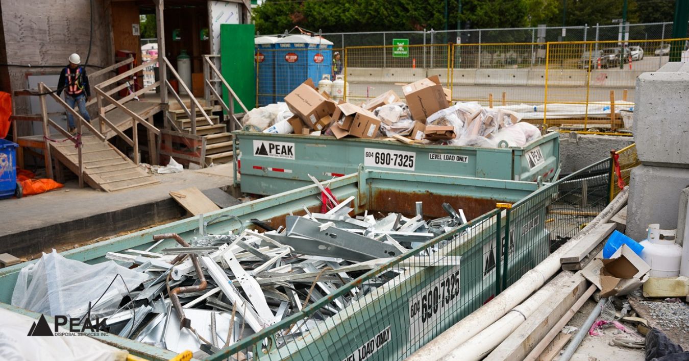Construction site bins filled with debris, showing waste management support for North Vancouver projects with placement planning assistance
